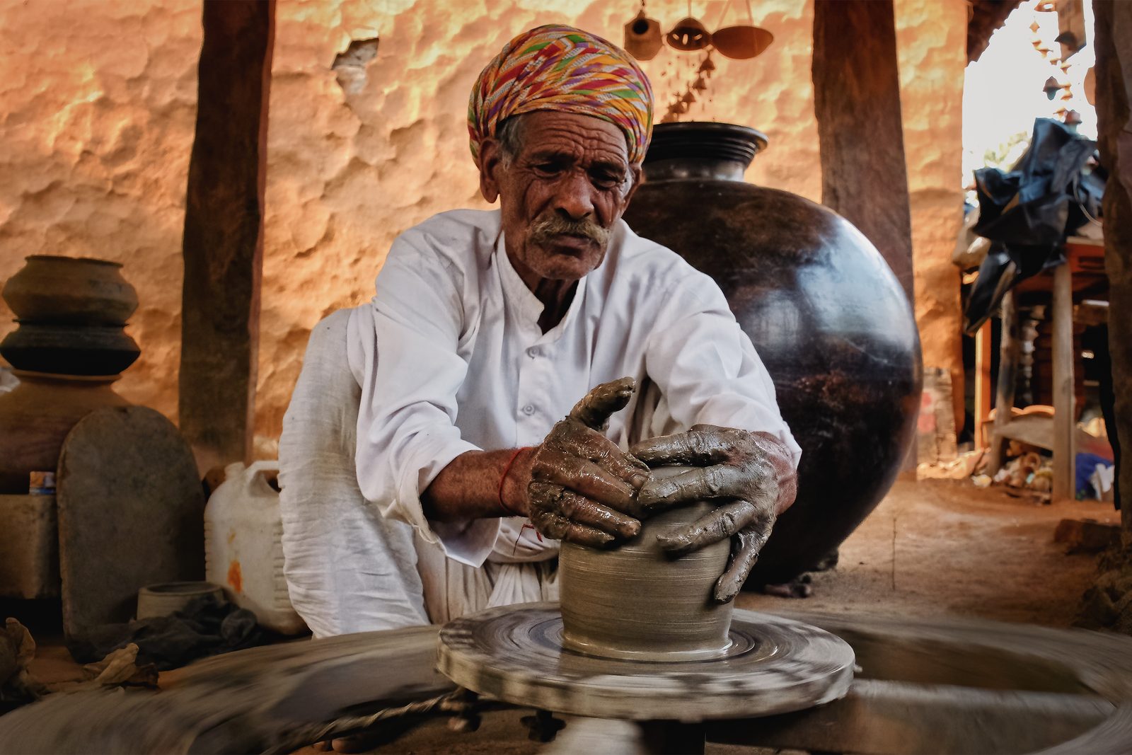 Indian potter shaping clay at Shilpgram