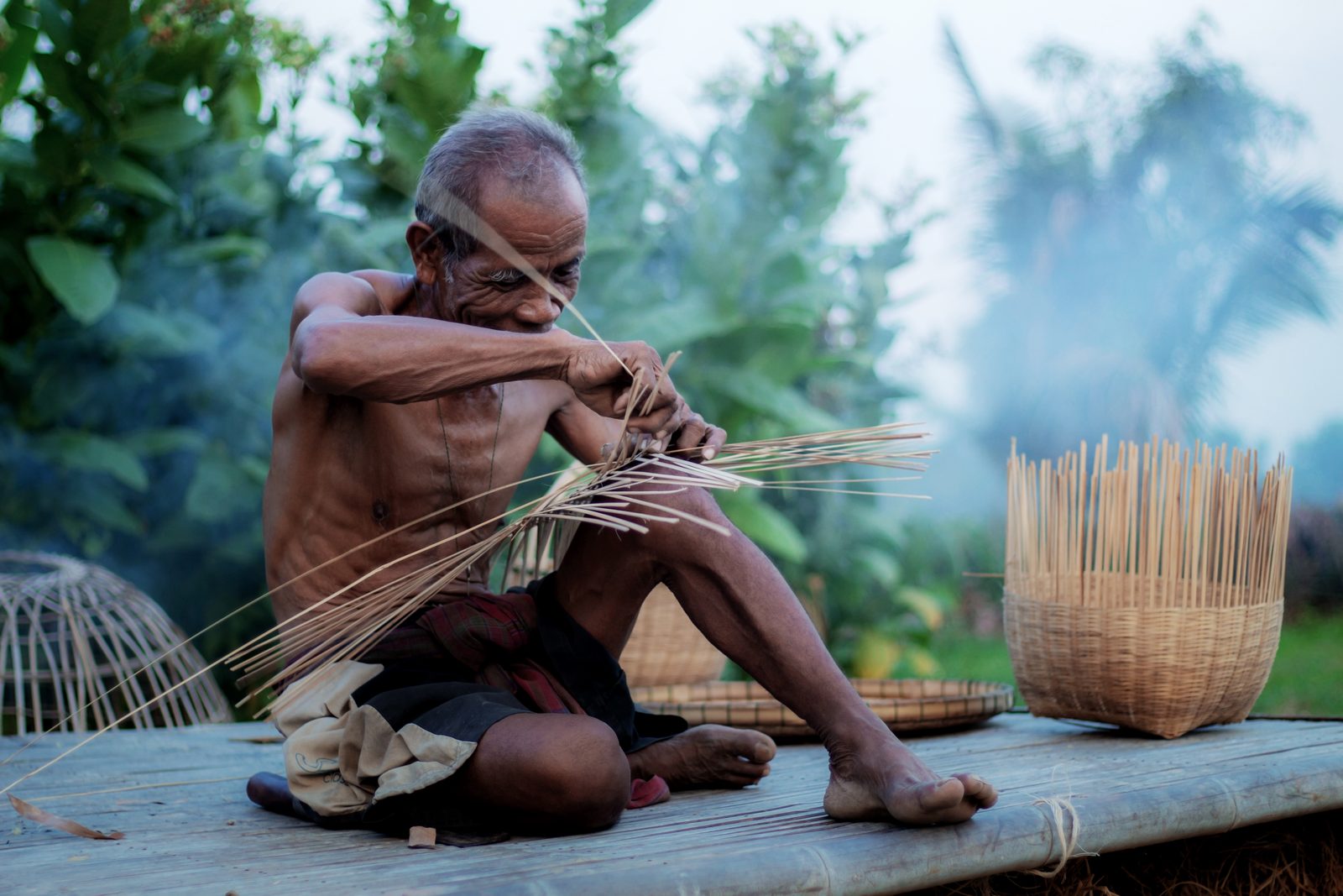 Master weaver working at his loom in rural India